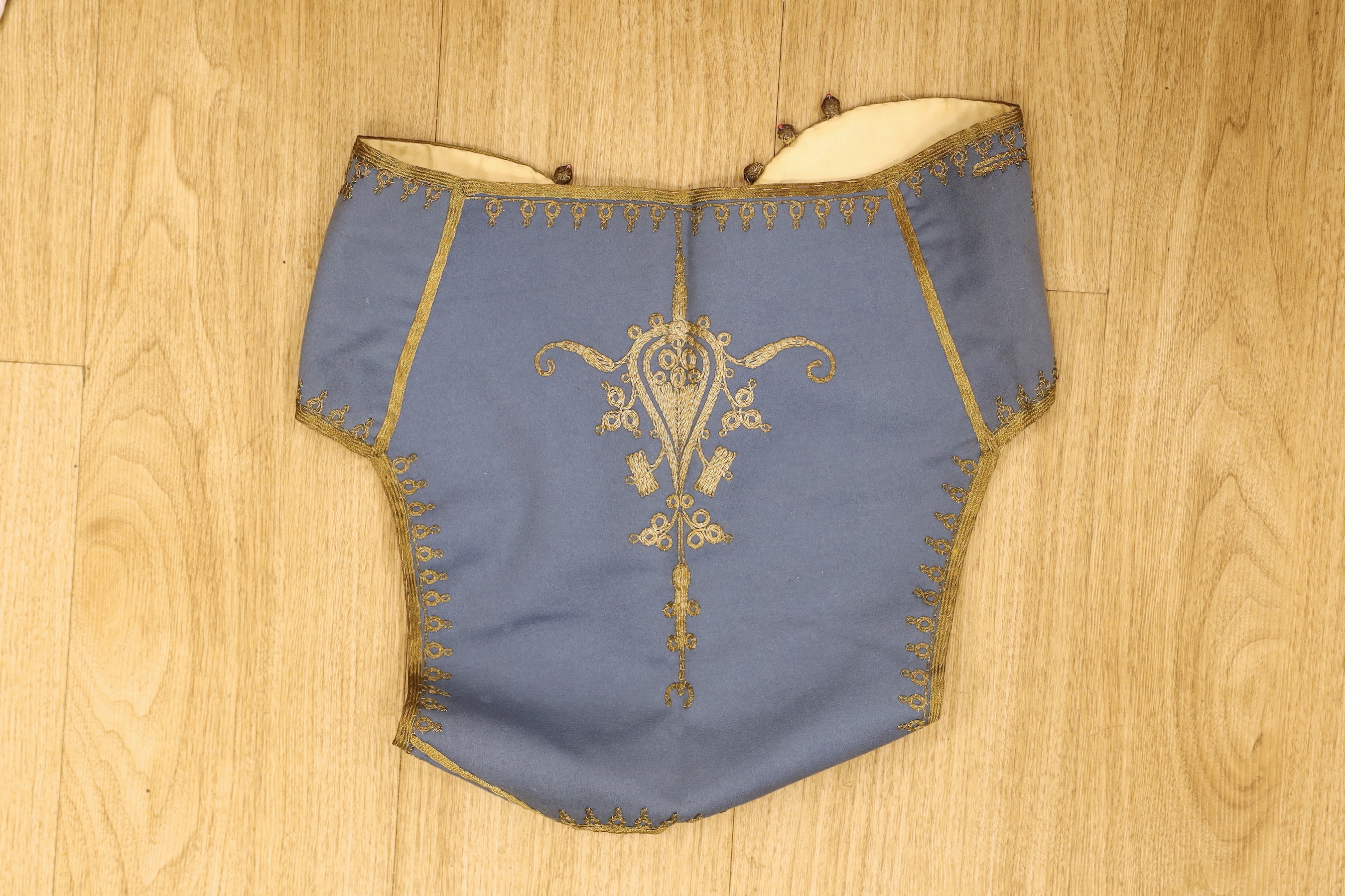 A Victorian child's waistcoat and cloak
